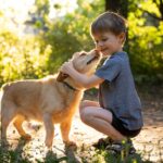 full shot kid hugging dog 23 2149048107